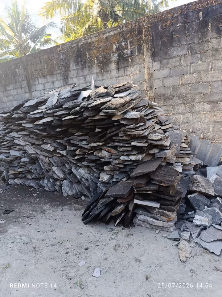 Stacks of thin irregular natural lava stone pieces